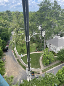 aerial view of crane boom arm from climbers view during tree service tuscaloosa county alabama