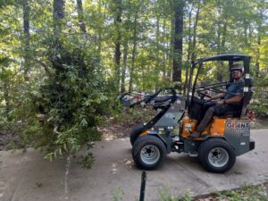 owner of company operating equipment while hauling tree debris away from work site located in tuscaloosa county alabama